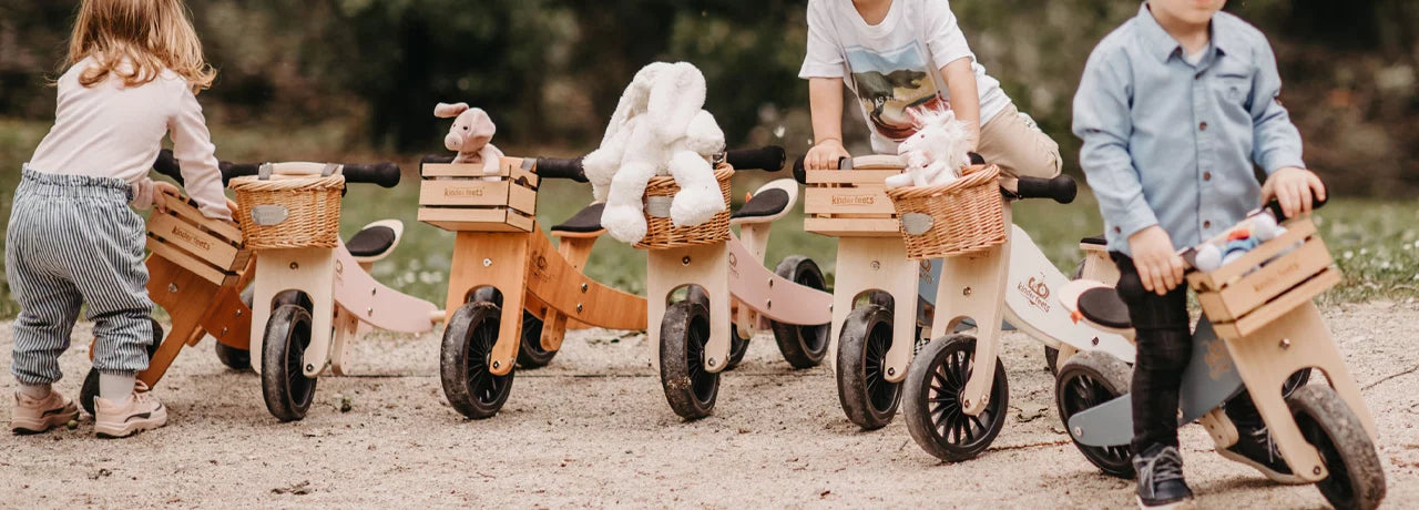Child on a wooden balance bike